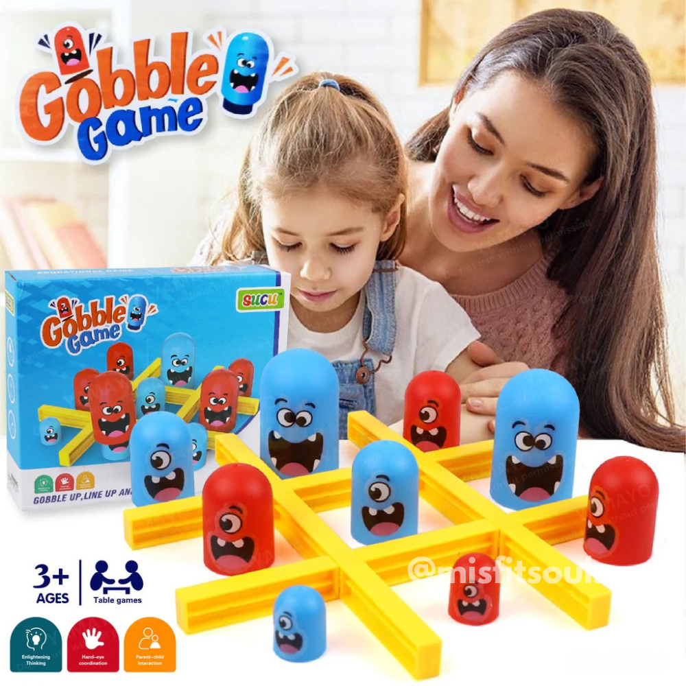 Mother and child playing Gobble Game, a colorful 3D tic-tac-toe board game with fun cartoon-faced gobbler pieces in red and blue. Educational family board game for kids aged 3+, perfect for early learning, strategy building, and family fun.